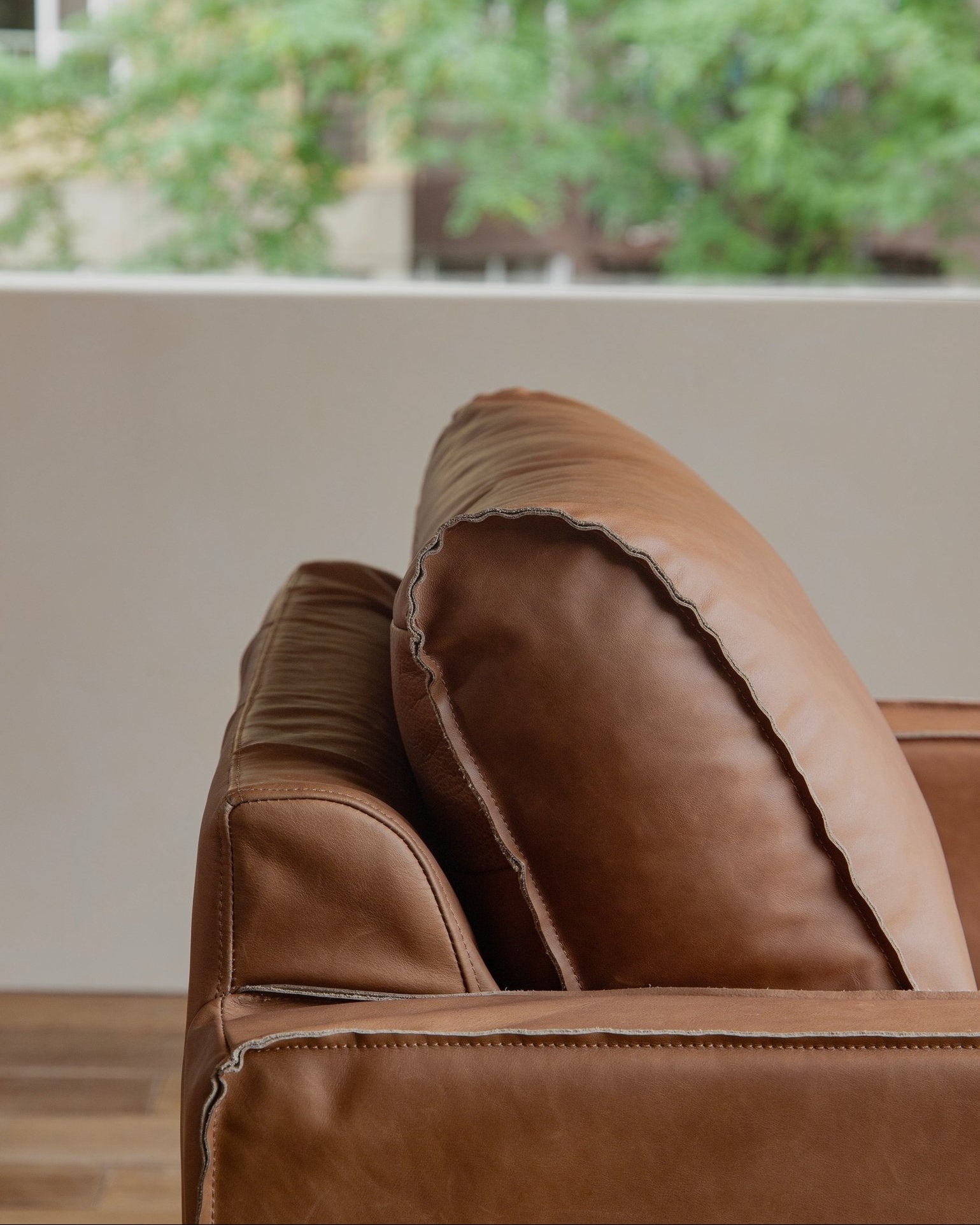 Brown top-grain leather skirt sofa detail, highlighting the quality and design