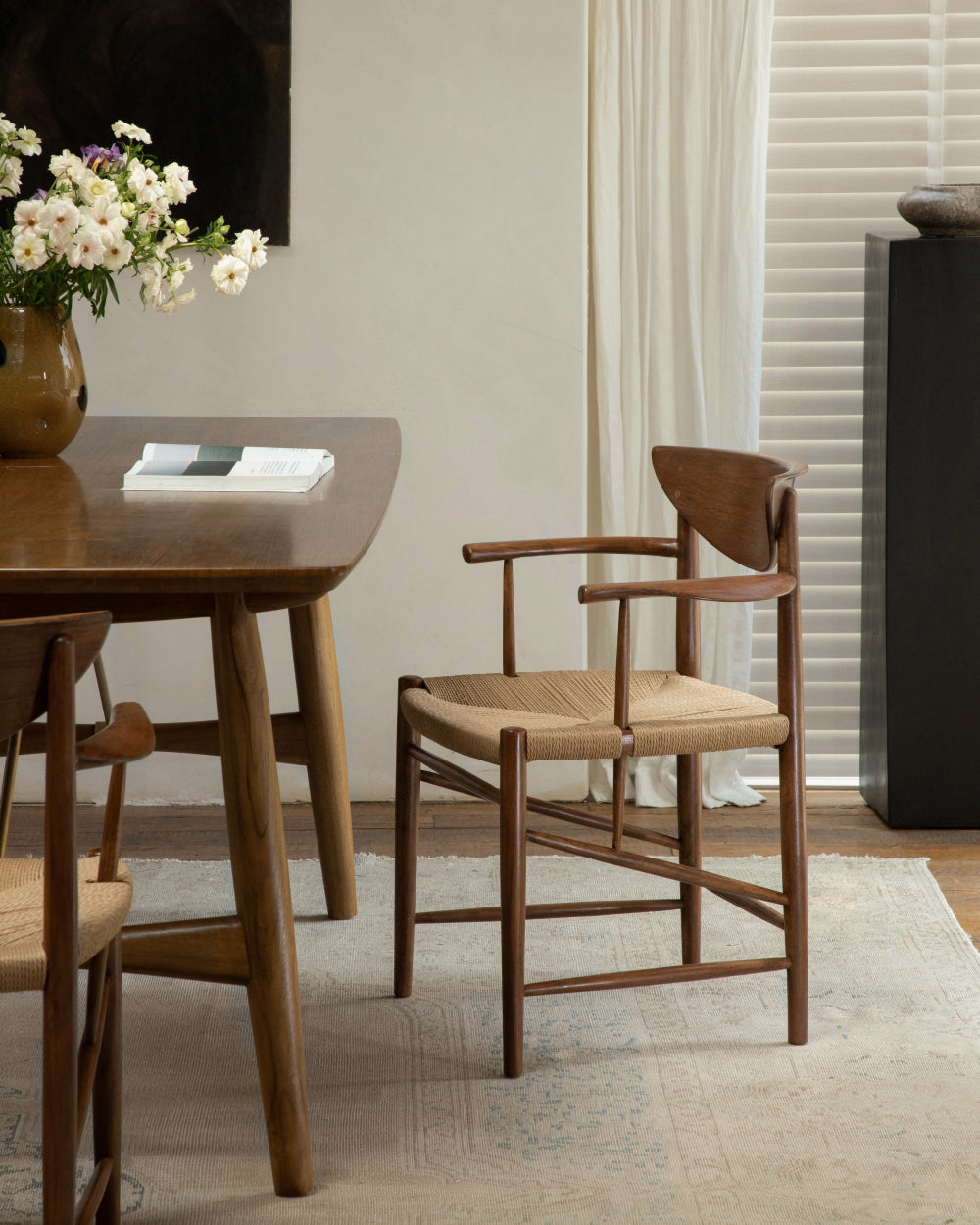 Henrik Dining Chair with natural woven rush seat and solid teak frame.