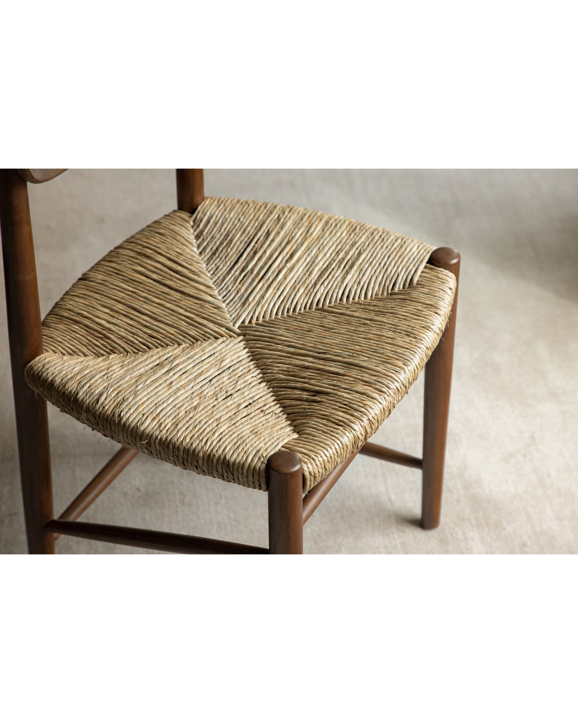 Margaret Dining Chair with handwoven rush seat and teak wood frame.