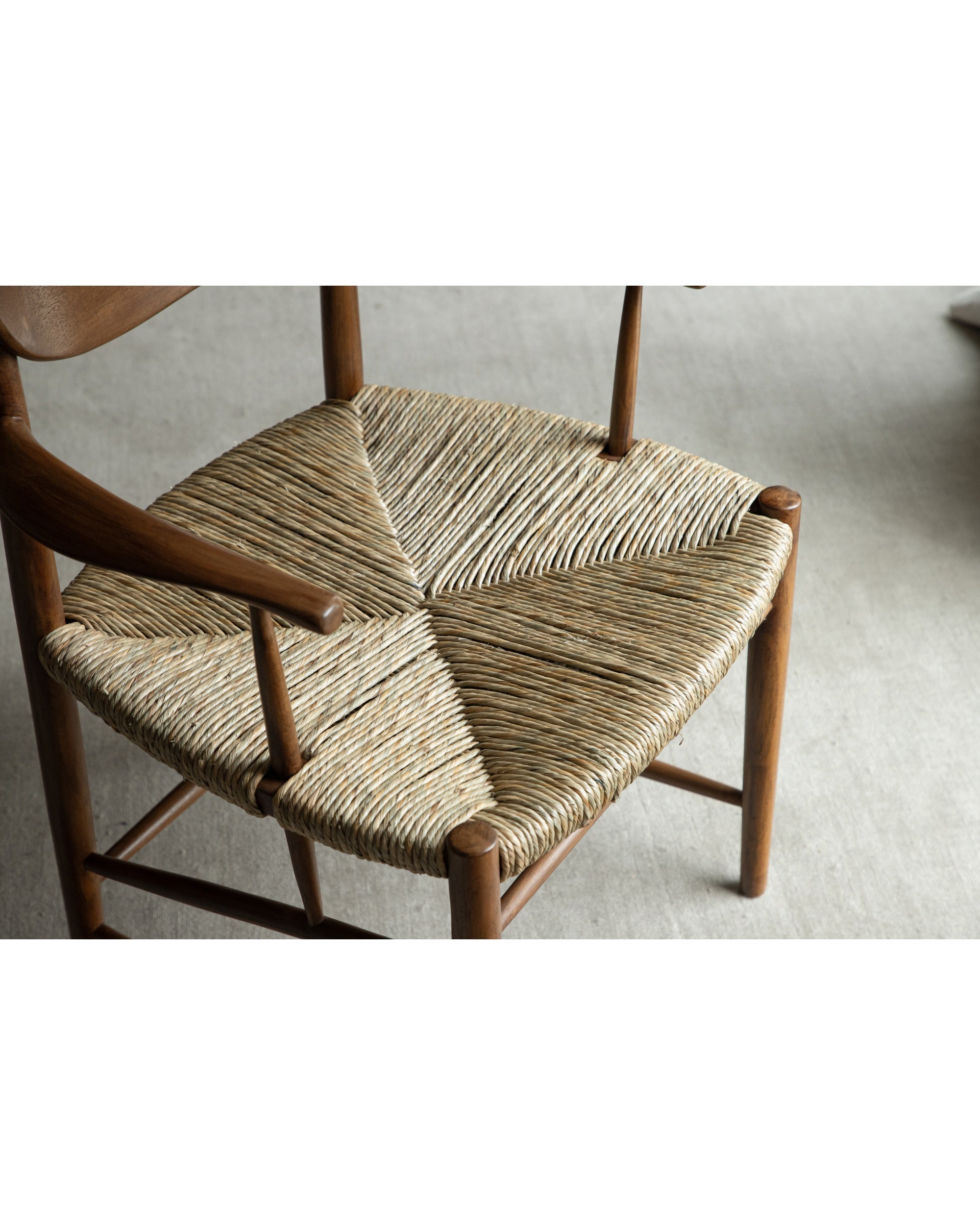 Henrik Dining Chair with woven rush/paper cord seat and teak frame.