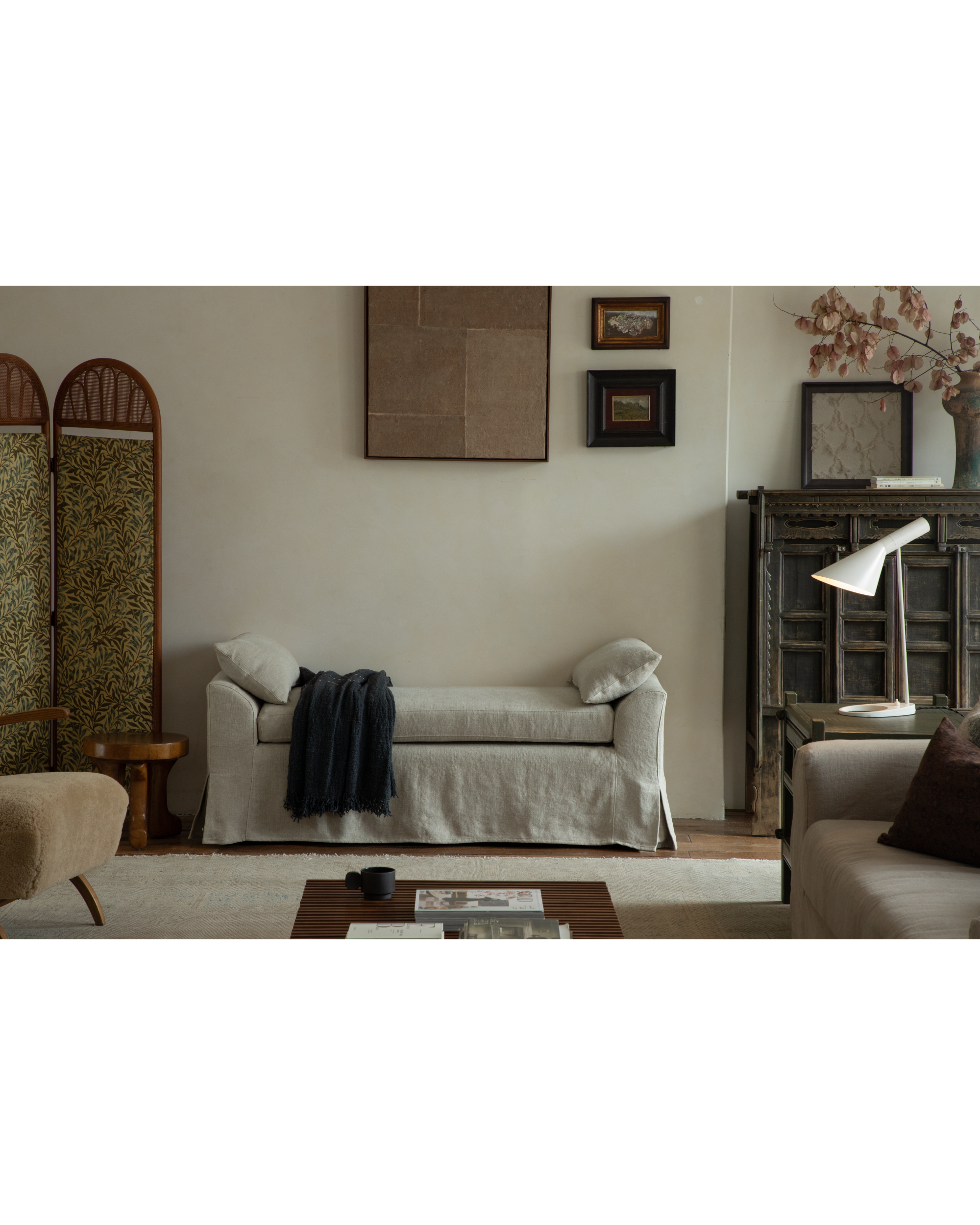 Linen gray Alina Bench with plush slipcover and draped throw