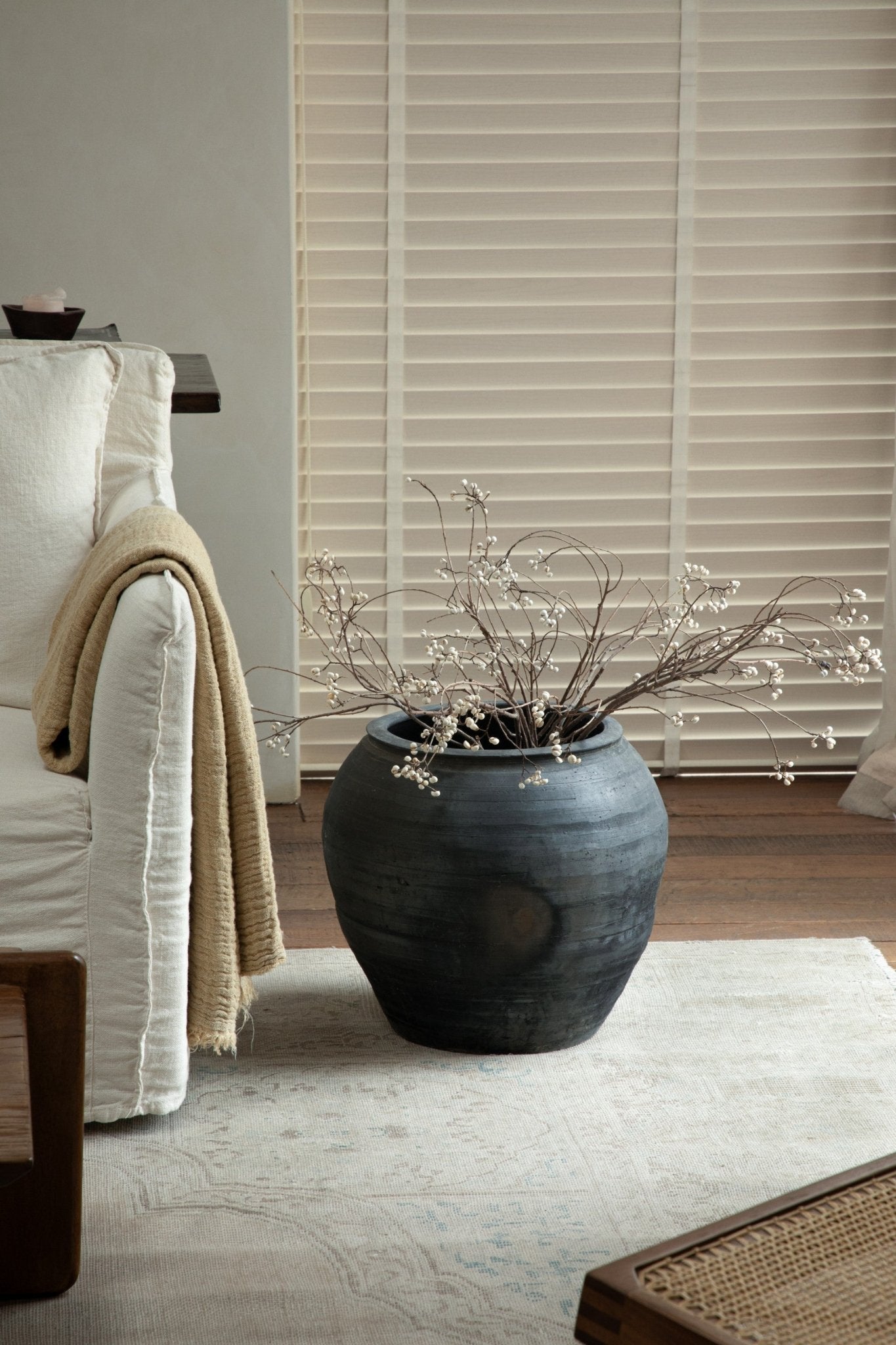 Large vintage clay pot with neutral colors, perfect for home decor. Includes clay material and a unique, textured finish