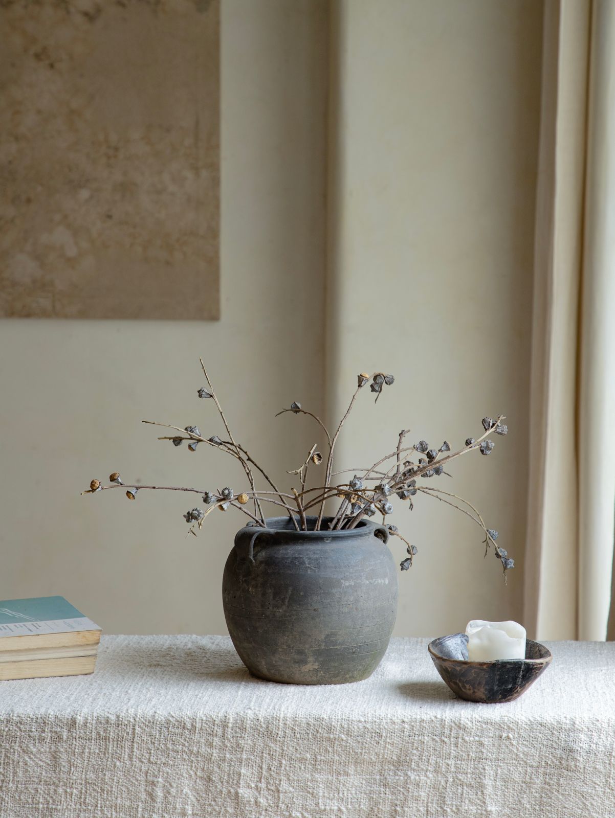 Vintage clay pot with dried branches, home decor accent, neutral color palette, clay material