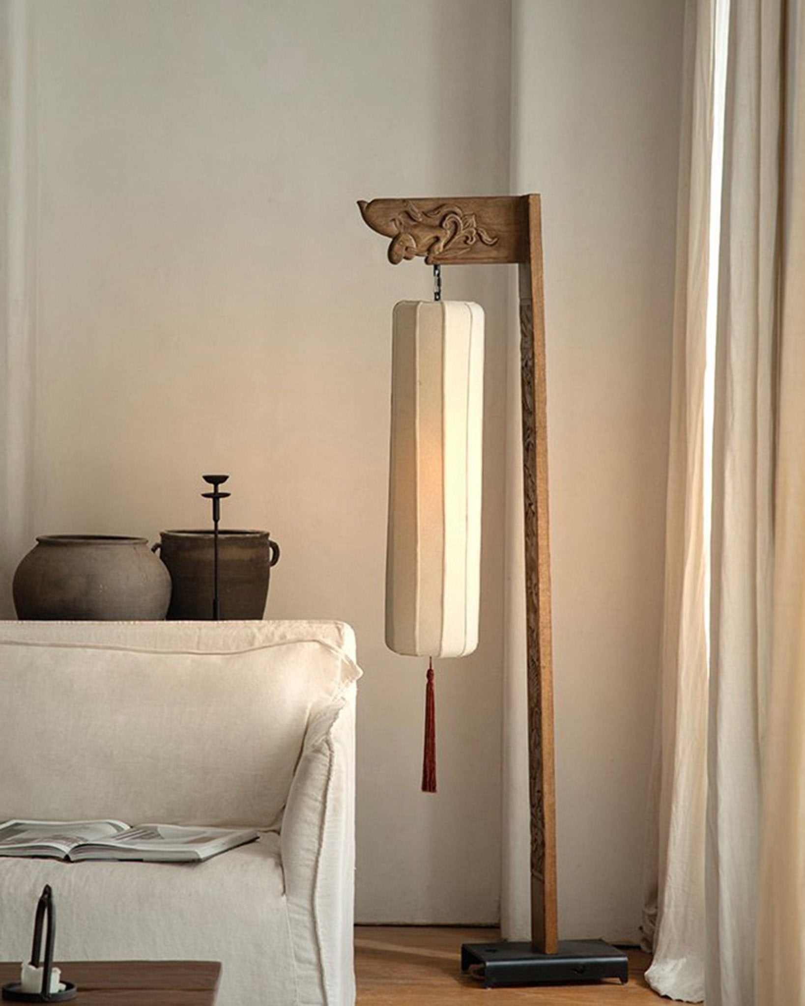 Chinese floor lamp with wooden frame, fabric shade, and tassel. Oriental home decor, minimalist design.