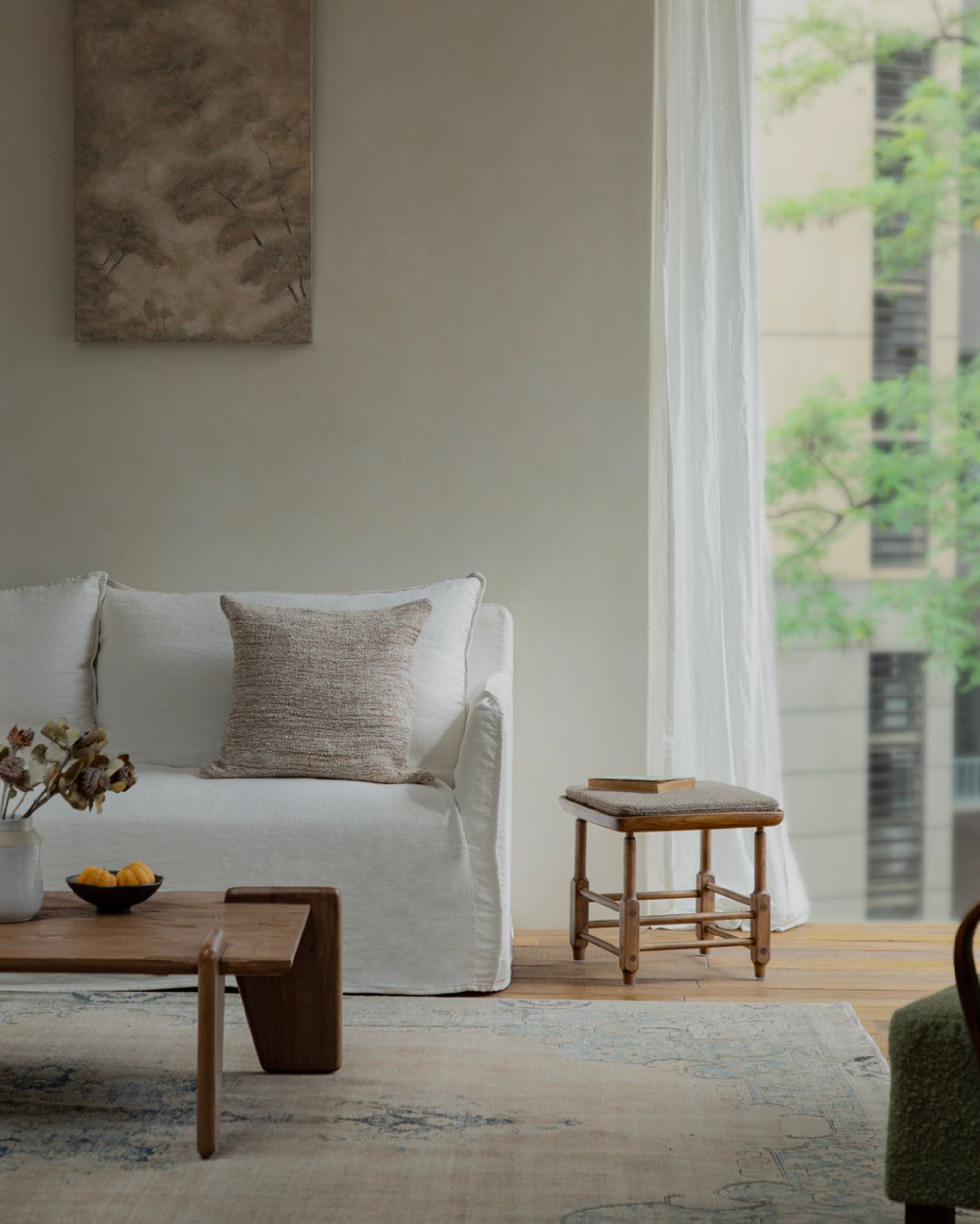 Magrini Stool in zebrawood in modern living room with a neutral cushion