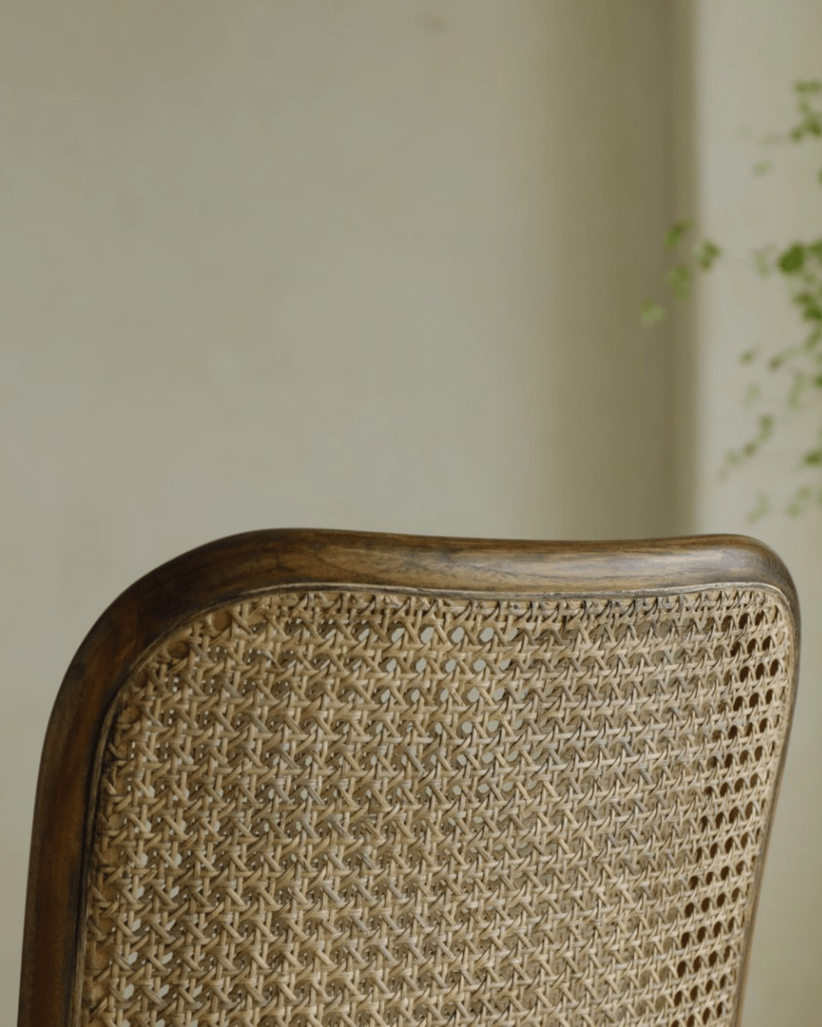 NO.811 Chair detail: Close-up of rattan backrest with teak frame, showcasing elegant design and natural materials.