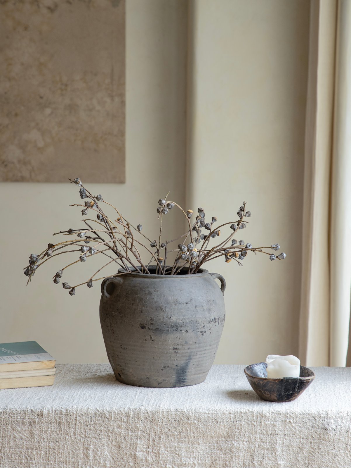 Vintage clay pot filled with branches, home decor accent, neutral color palette, clay material