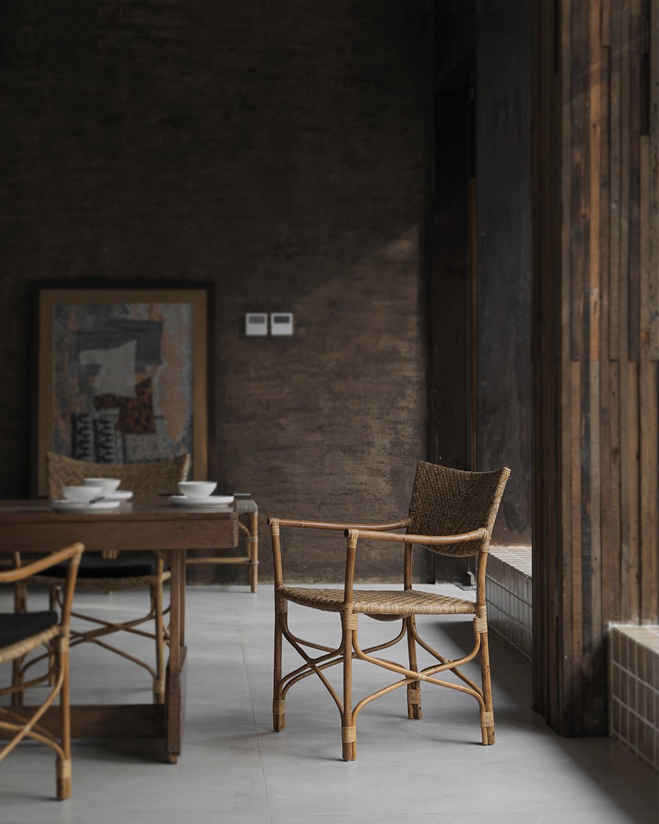 Dingee Chair with woven back, natural wood frame, in dining room setting.