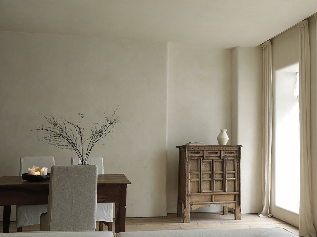 Chinese cabinet in a dining room, crafted from reclaimed wood, offering versatile storage solutions