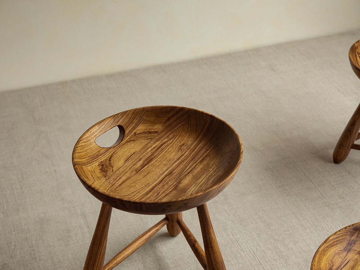 Zebrawood Mocho stool with handle detail, showcasing the natural wood grain and organic design