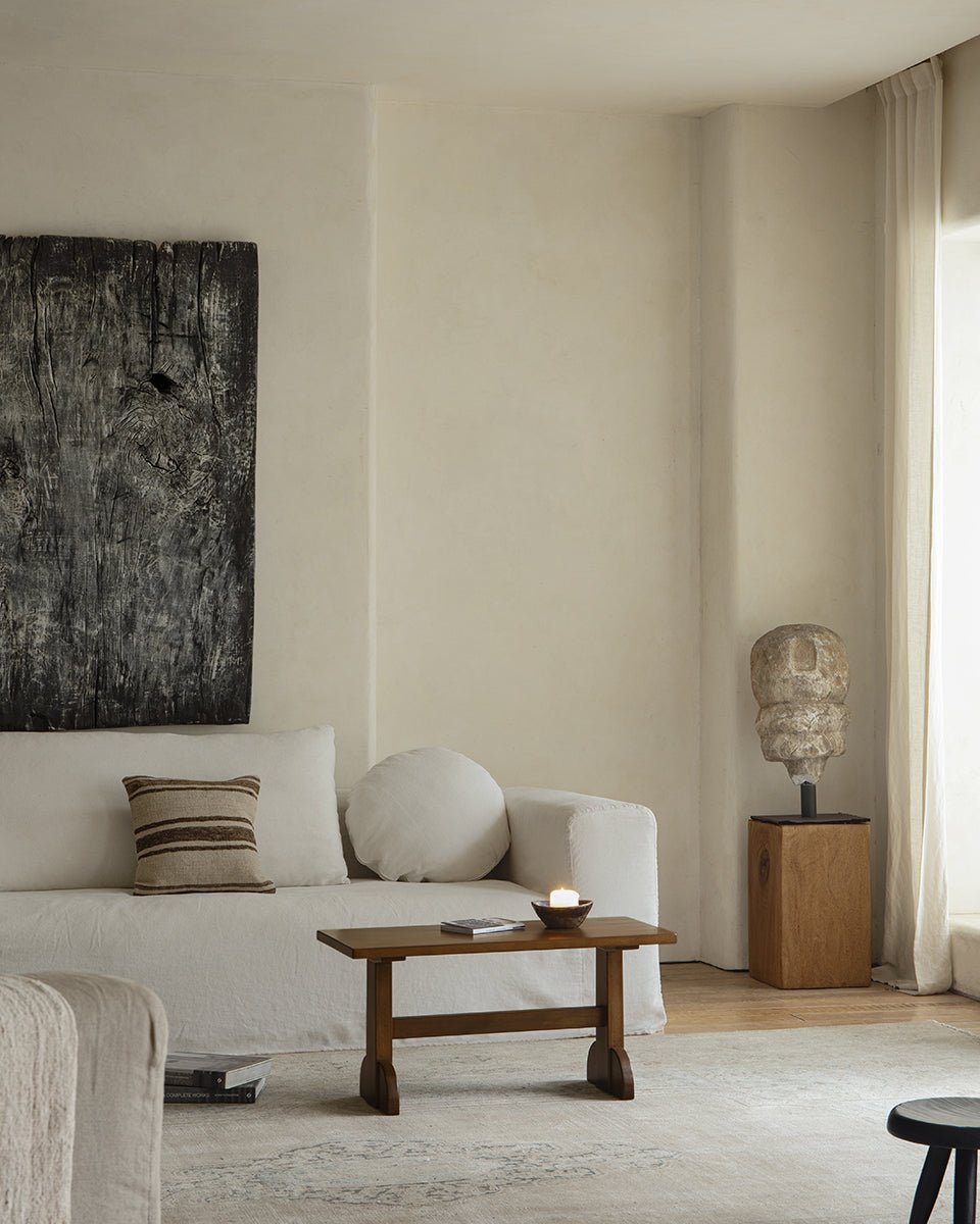 Hoof Side Table in a retro-style living room setting, showcasing nanmu wood construction and horseshoe design.