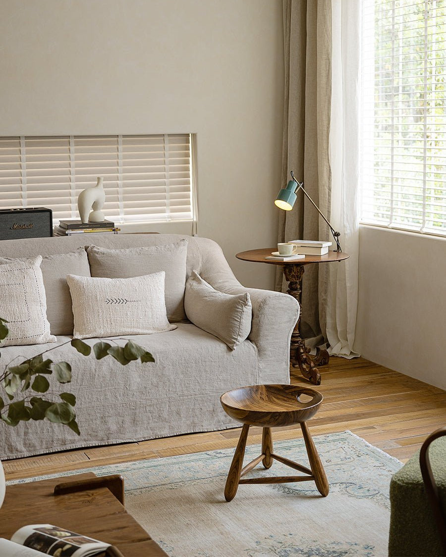 Mocho Stool in a modern living room setting, zebrawood stool with an organic design