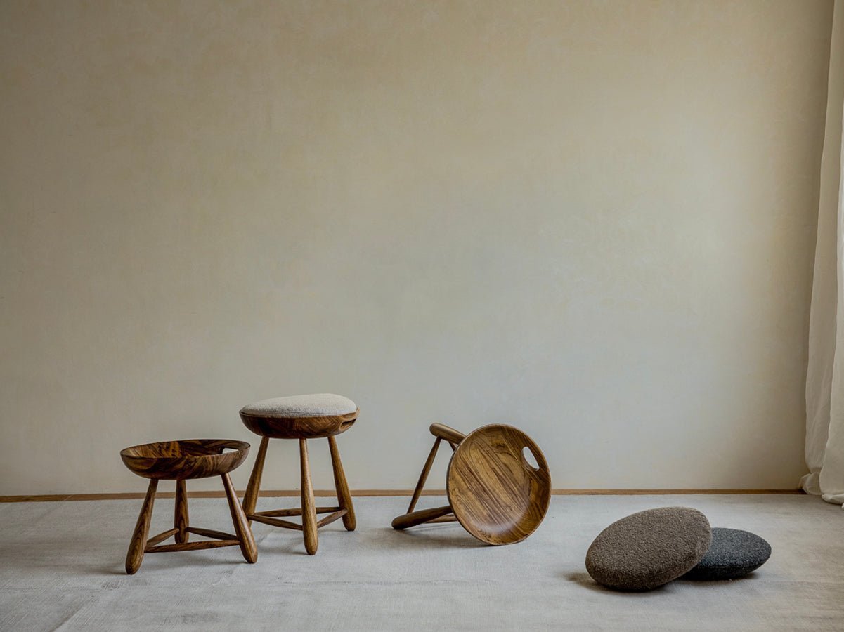 Zebrawood Mocho Stools in a neutral setting showcasing the wooden texture and organic design. Cushioned seat options.