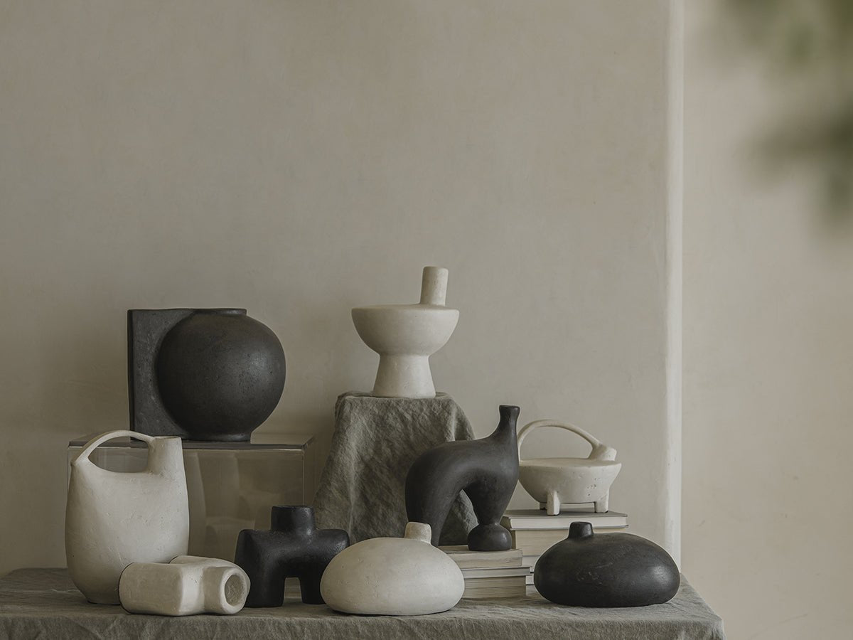 Sandy Vase clay collection in black and white, minimalist ceramic vases, clay material, unique shapes for decor.