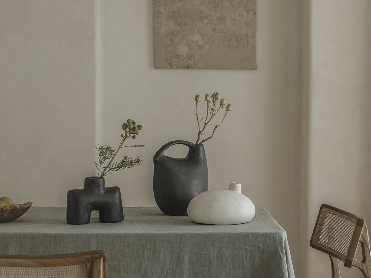 Sandy Vase clay collection in minimalist style. Black, white and grey ceramic vases with unique shapes, clay material