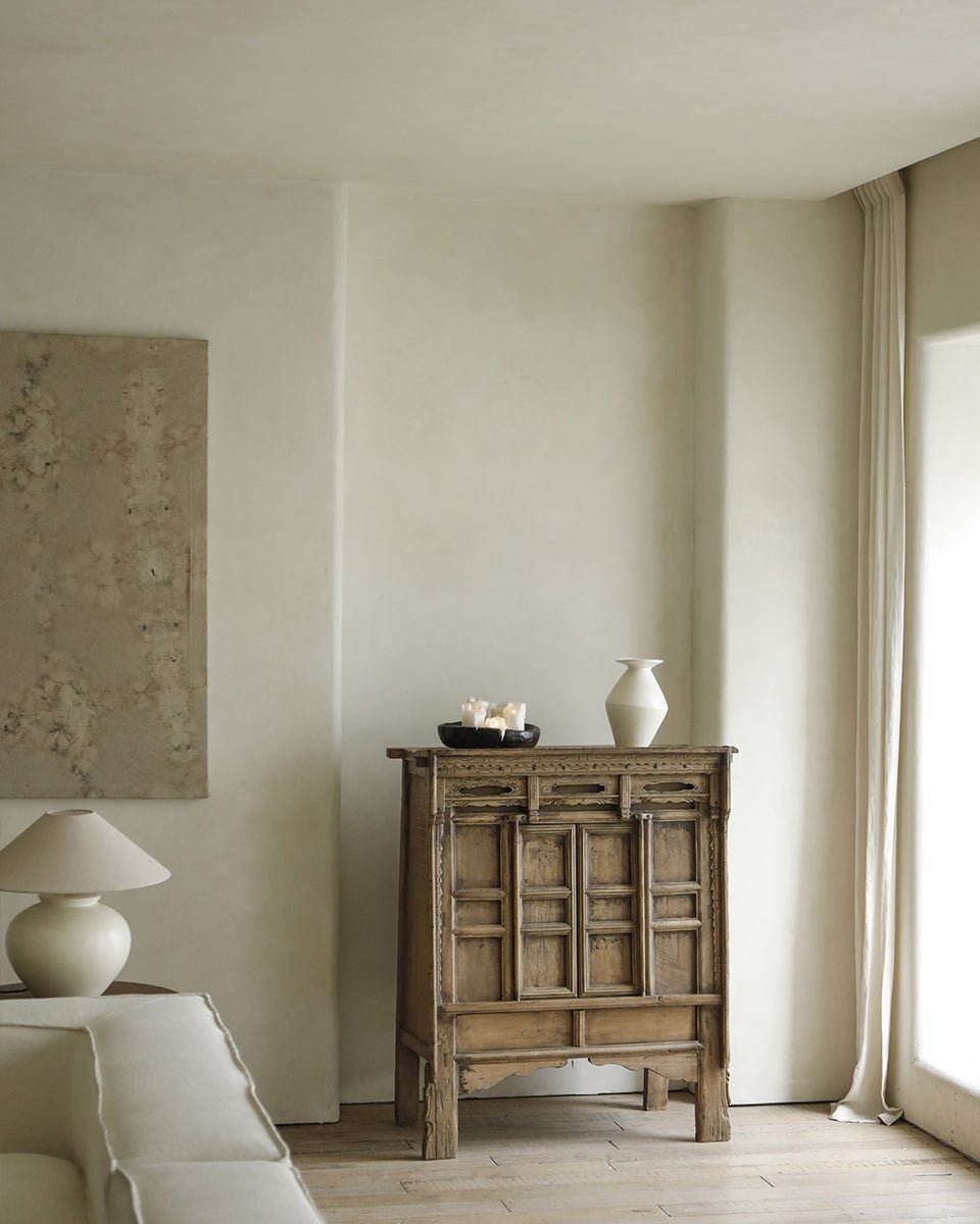 Chinese cabinet with detailed paneling, offering versatile storage. Made with reclaimed materials.