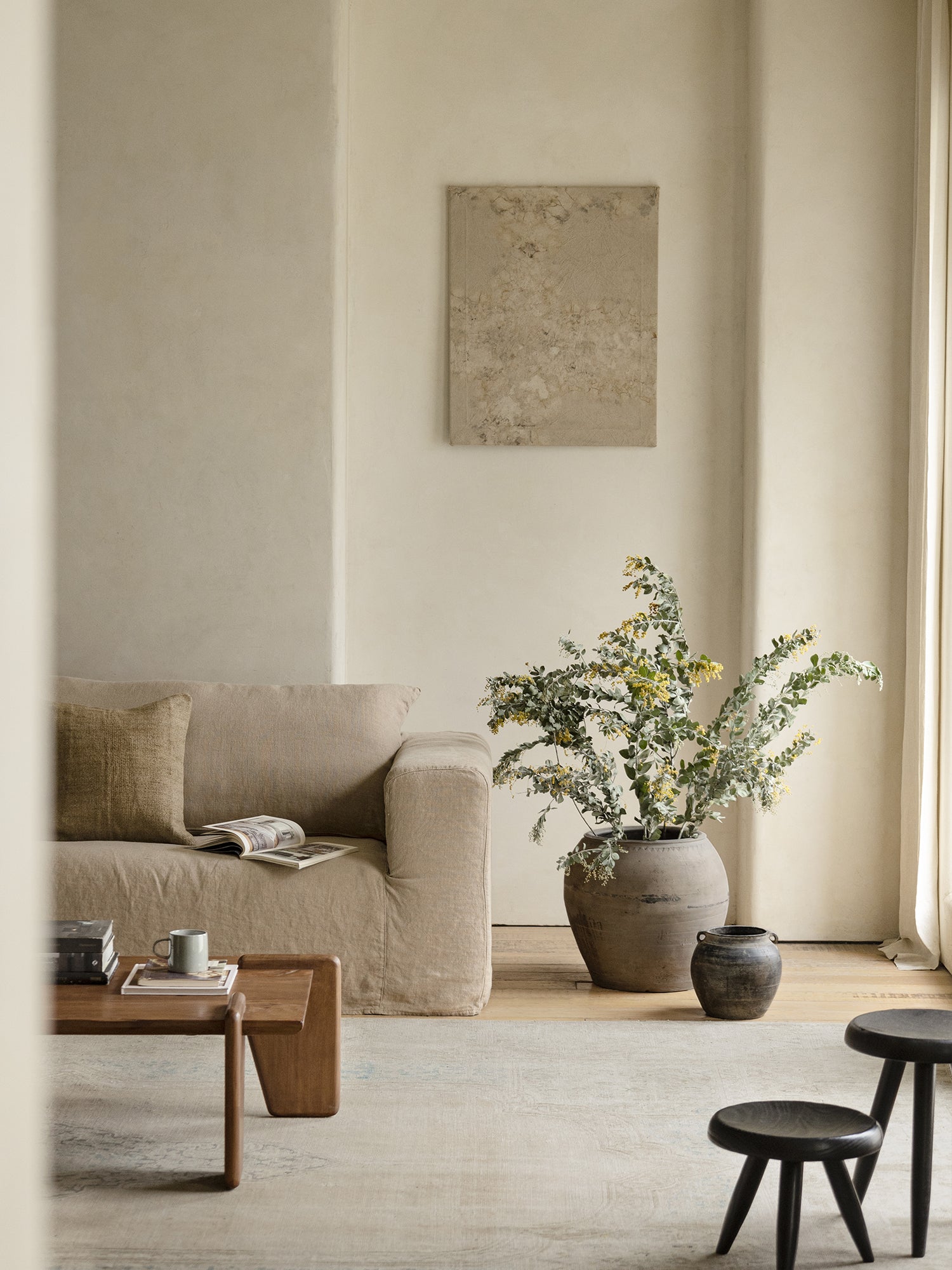 Large clay pot with greenery, home decor accent, interior design with natural clay elements and wooden accents