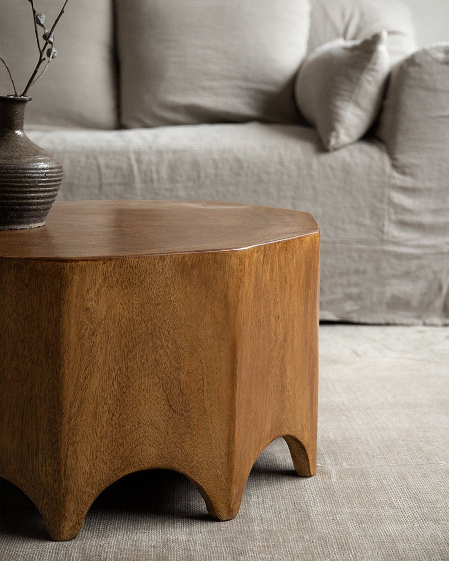 Decagon Side Table crafted from solid rainwood, ten-sided design, natural wood grain, in a modern living room setting.