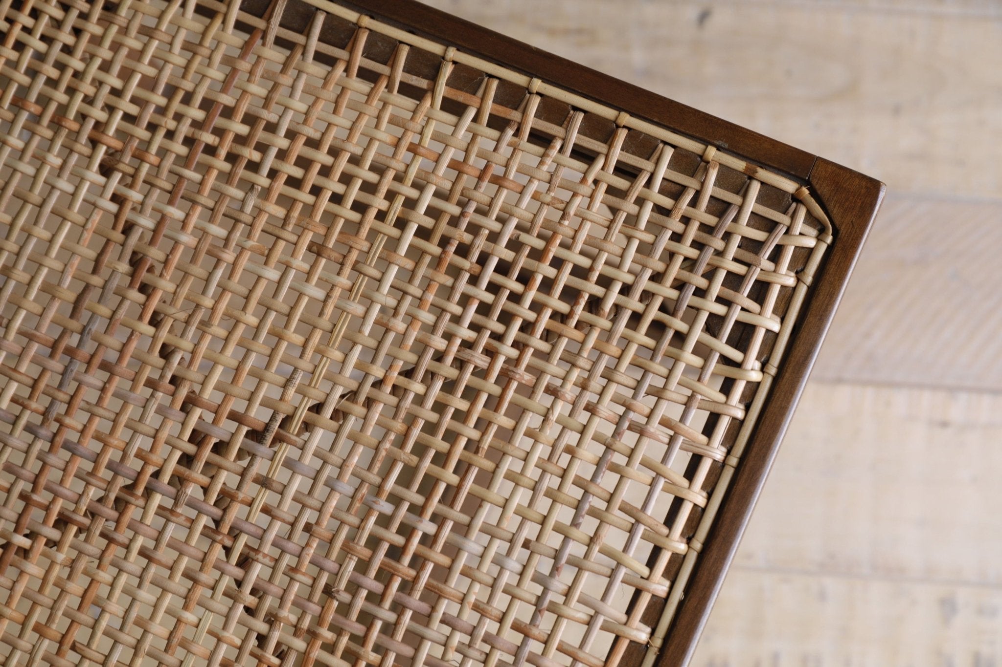Chandigarh Box Chair detail: handwoven rattan seat and dark wooden frame, Mid-Century Modern design