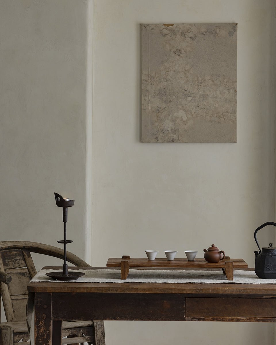 Chinese tea tray set with teapot and cups on reclaimed wood table, rustic and antique design