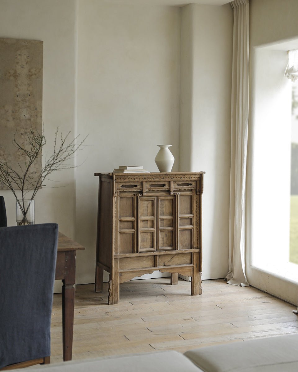 Chinese cabinet in a bright room, featuring versatile storage and reclaimed materials; product image.