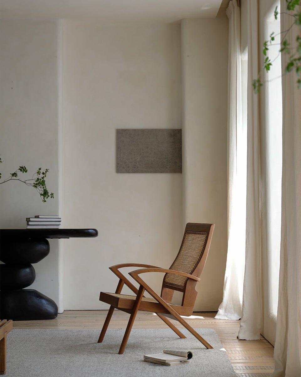 Rex Easy Chair in a light and airy room, teak wood and rattan armchair, vintage design.
