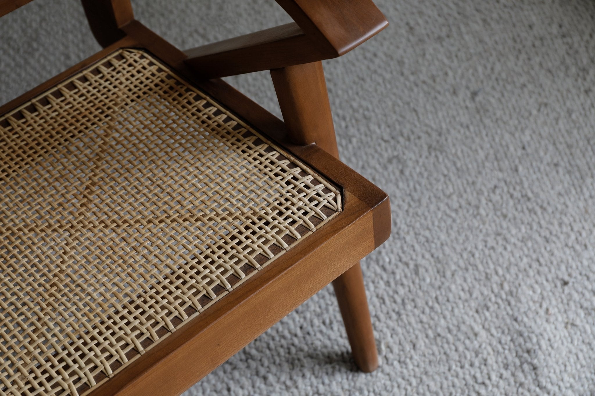 Rex Easy Chair detail: Teak wood frame and handwoven rattan seat, vintage lounge chair design