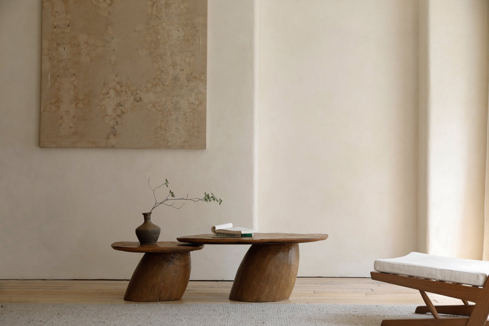 Alva Side Table in natural wood, with a distorted base and organic design. Playful elegance for modern interiors.