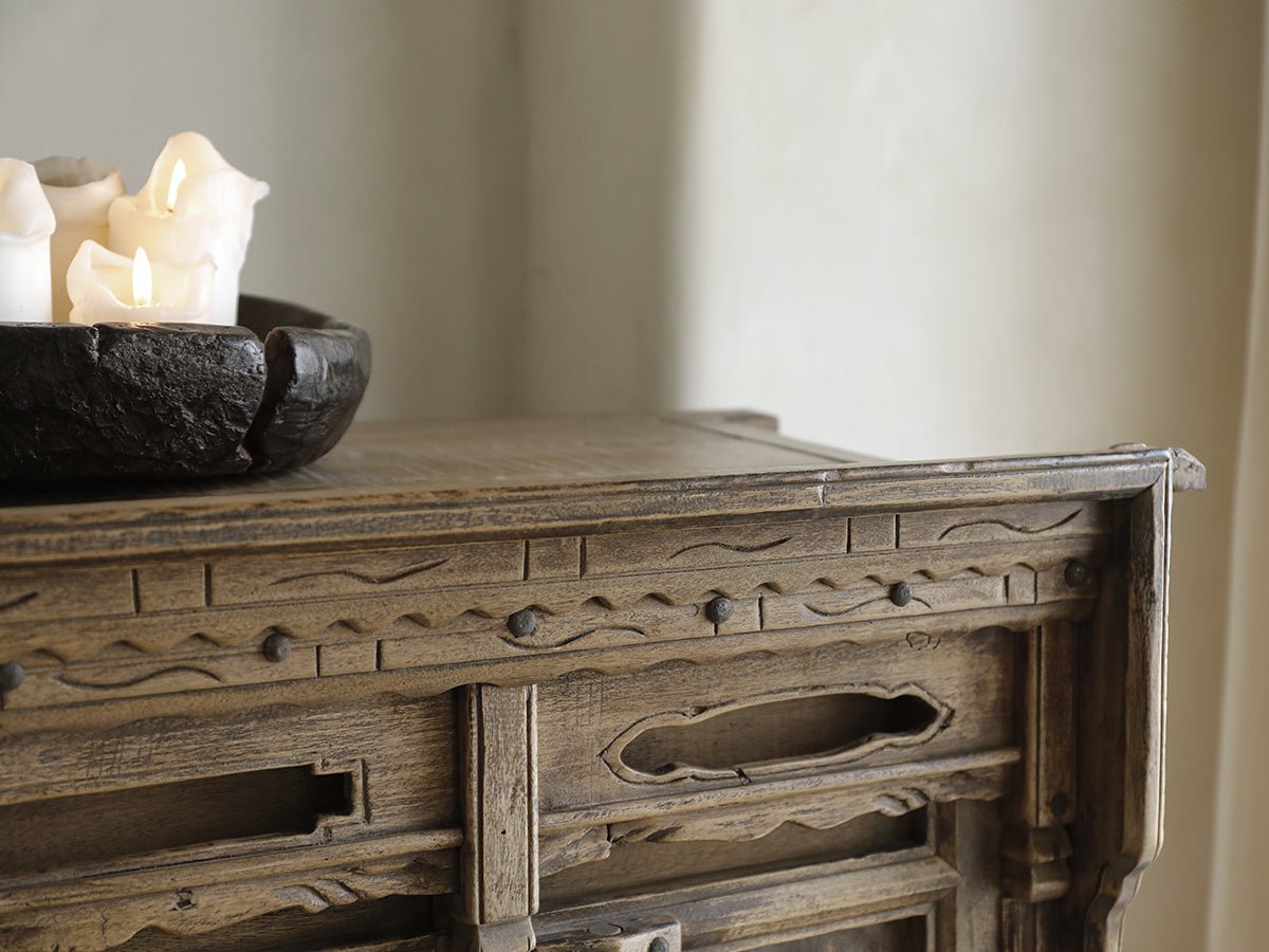 Detailed Chinese cabinet with wood carving and versatile storage, made with reclaimed materials.