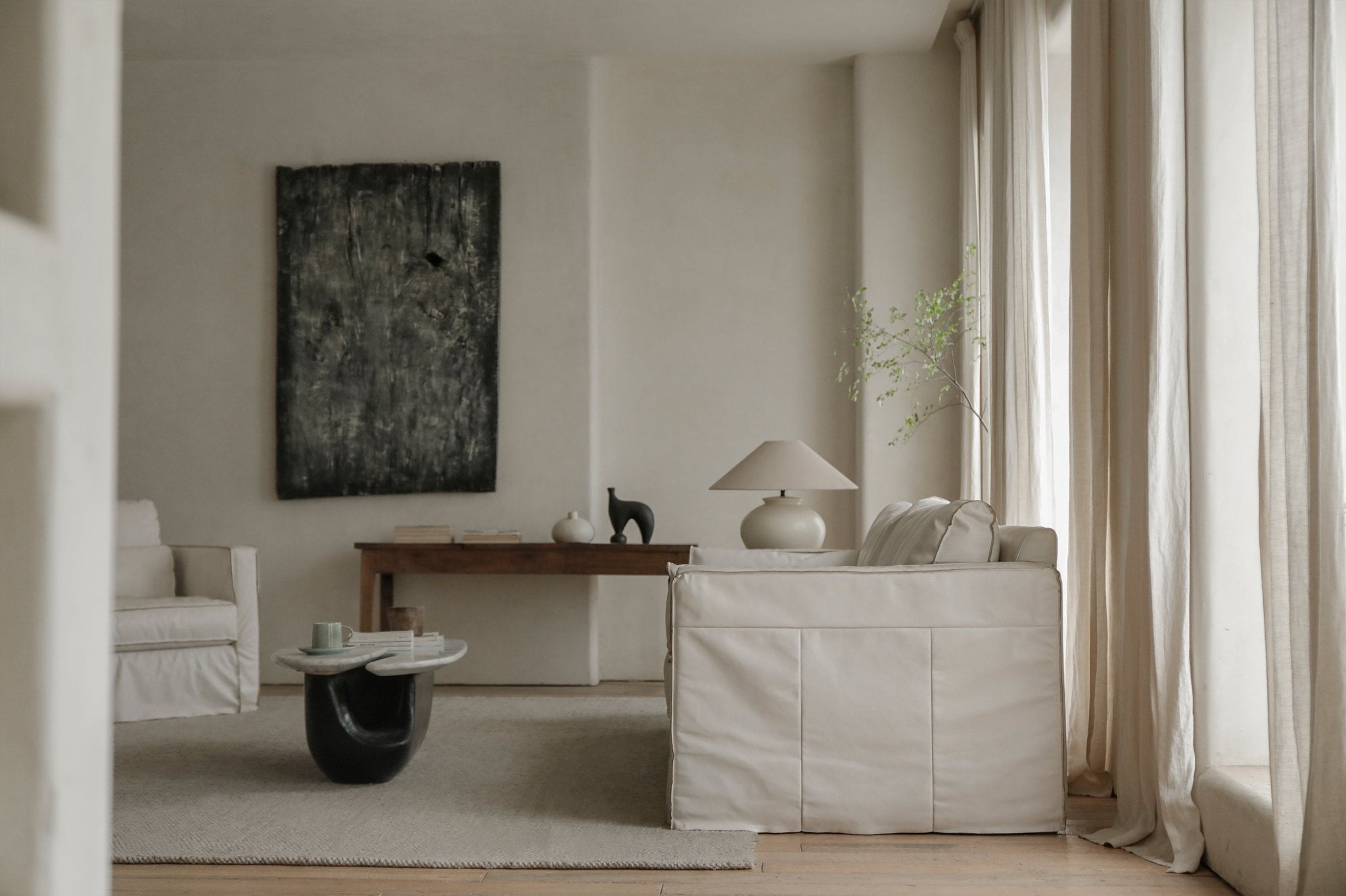 Cream skirt leather sofa in modern living room, highlighting top-grain leather skirt design
