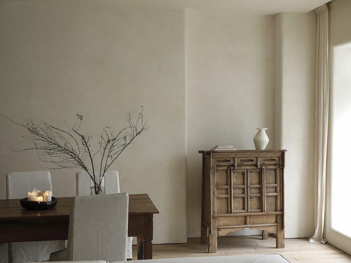 Chinese cabinet in a dining room setting, crafted from reclaimed materials for versatile storage