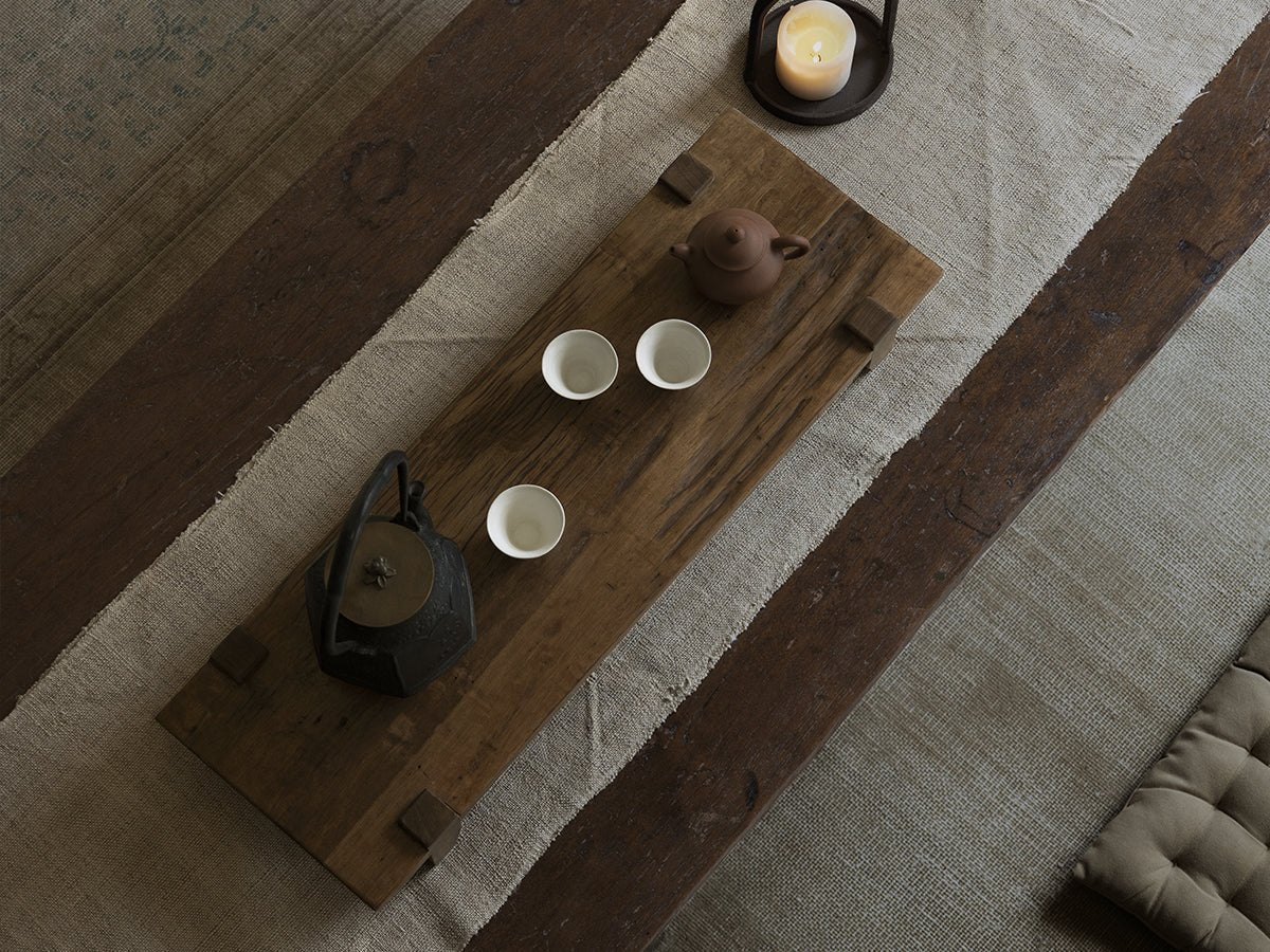 Chinese tea tray set with teapot and cups on reclaimed wood, rustic design, antique and serene