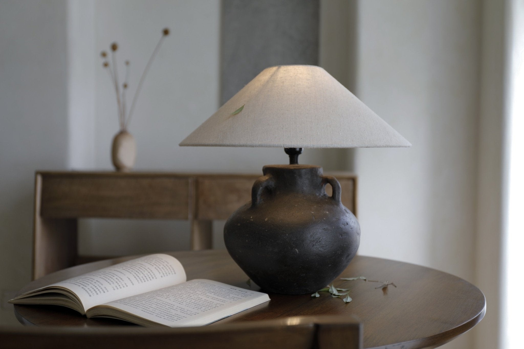 Ear Lamp with Clay Base and White Shade, with book and decor