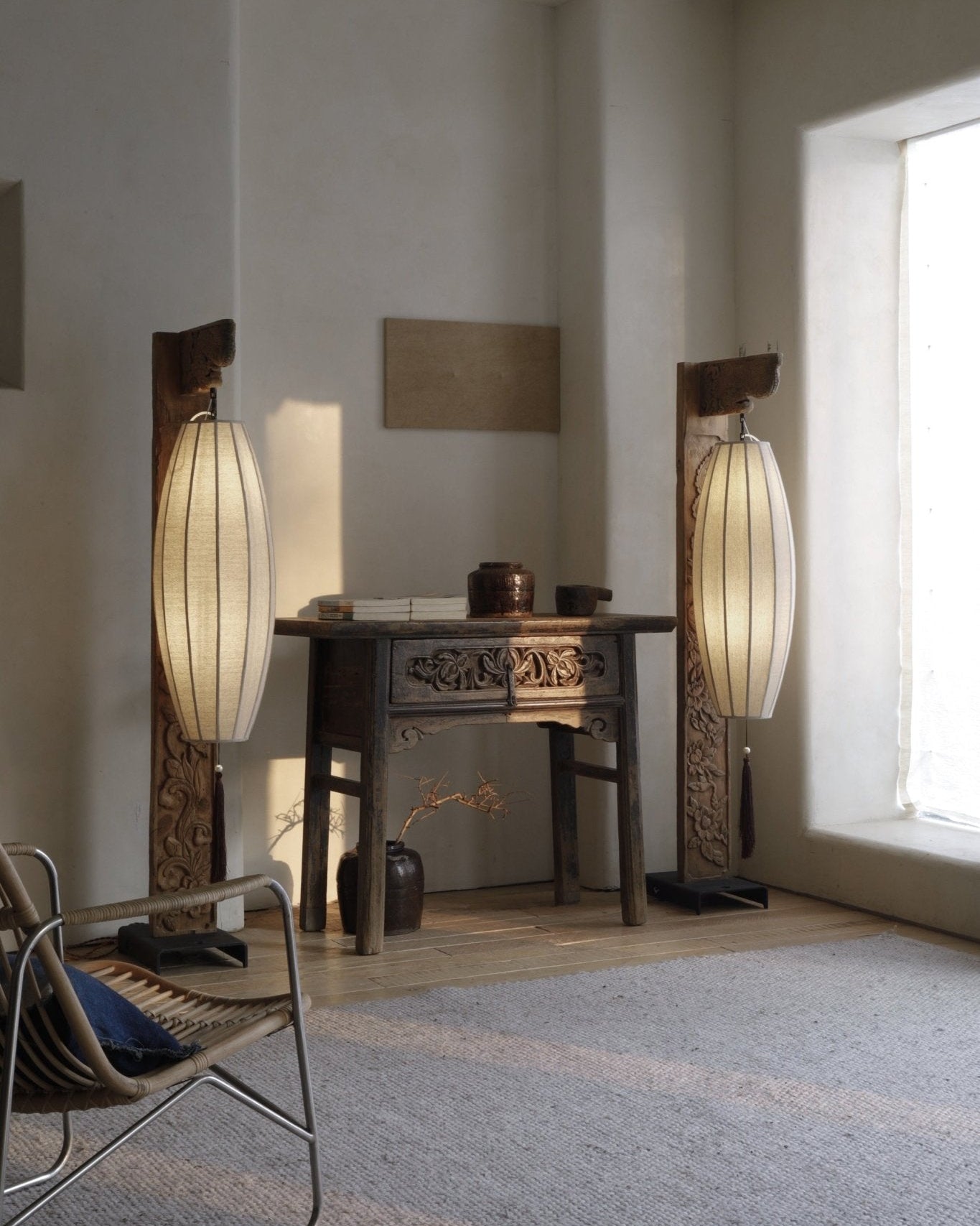 Chinese floor lamps with wooden frame and fabric shades in a room with wooden antique table, oriental style home decor