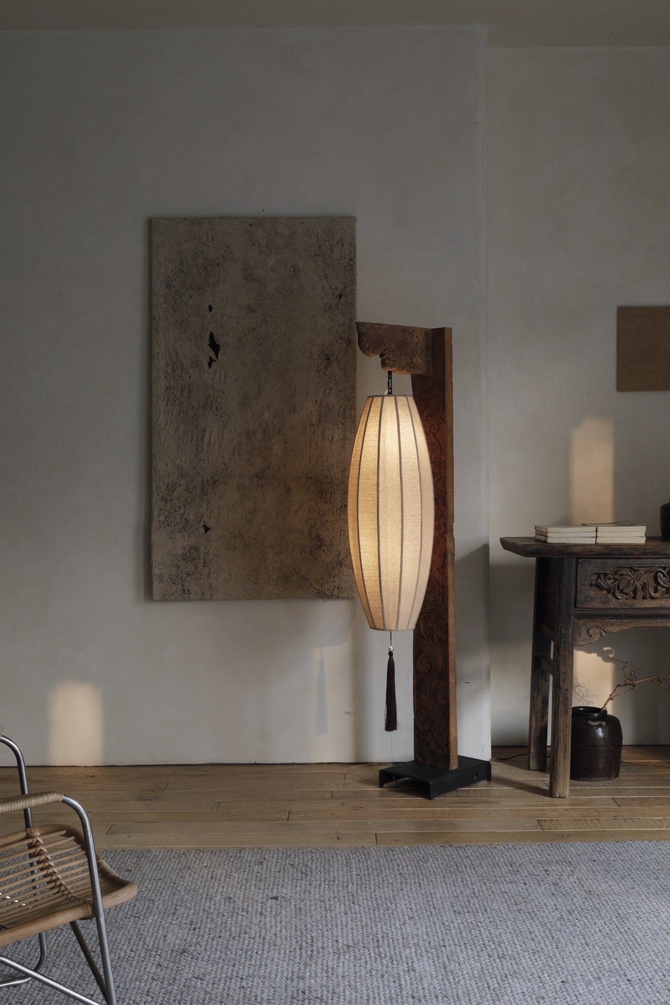Chinese floor lamp with fabric shade and wooden frame. Oriental style home decor.
