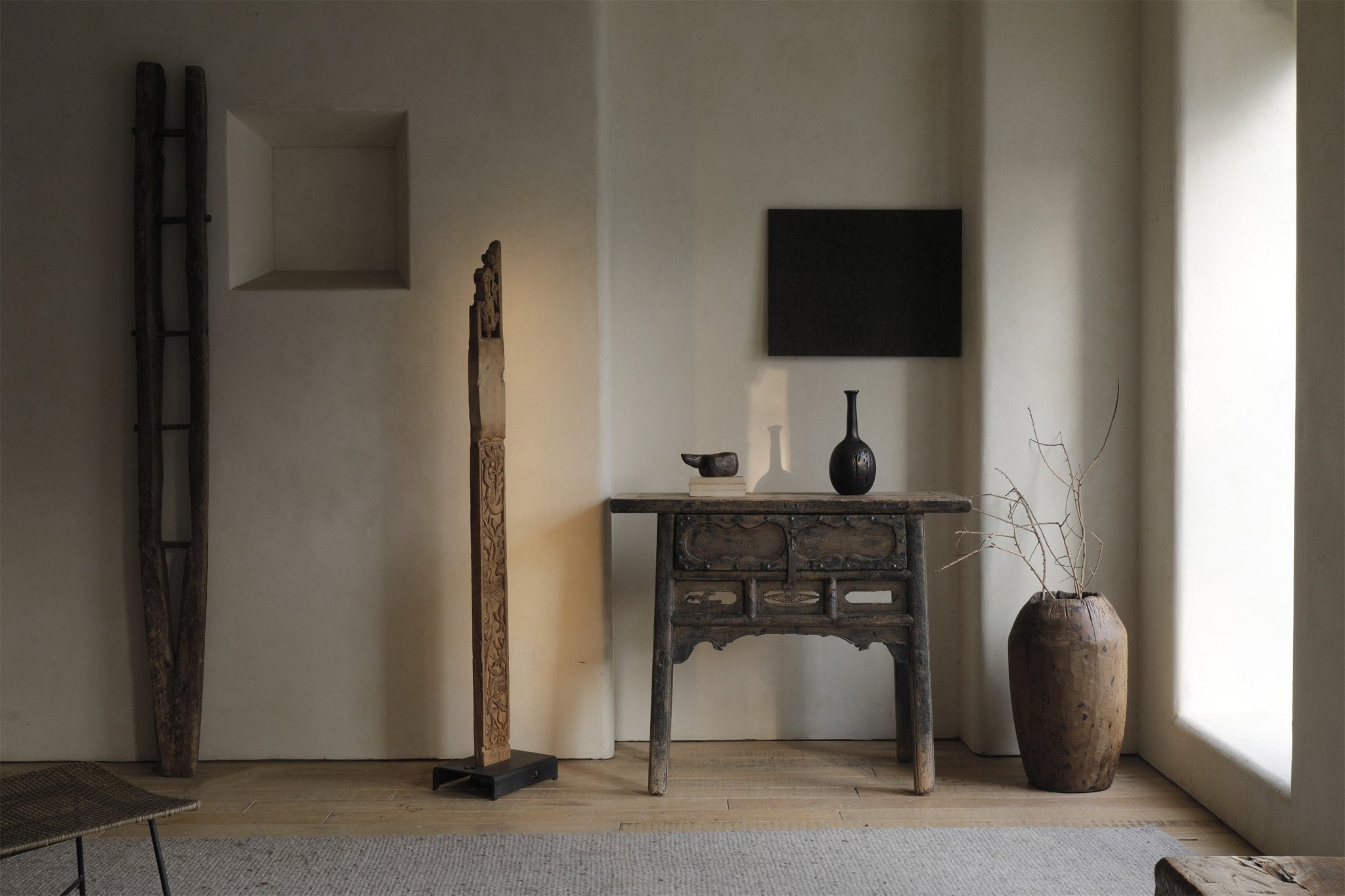Chinese floor lamp, wooden frame, oriental style decor. Antique wooden table and vase complete the room.