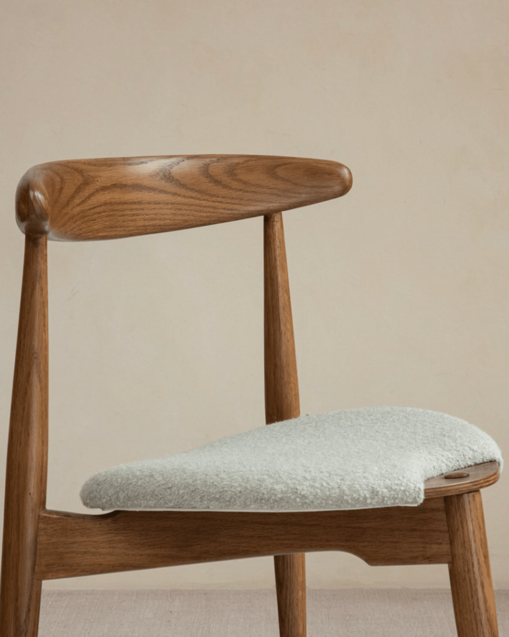 Heart Dining Chair with oak wood frame and bouclé seat. Danish design for vintage interior.