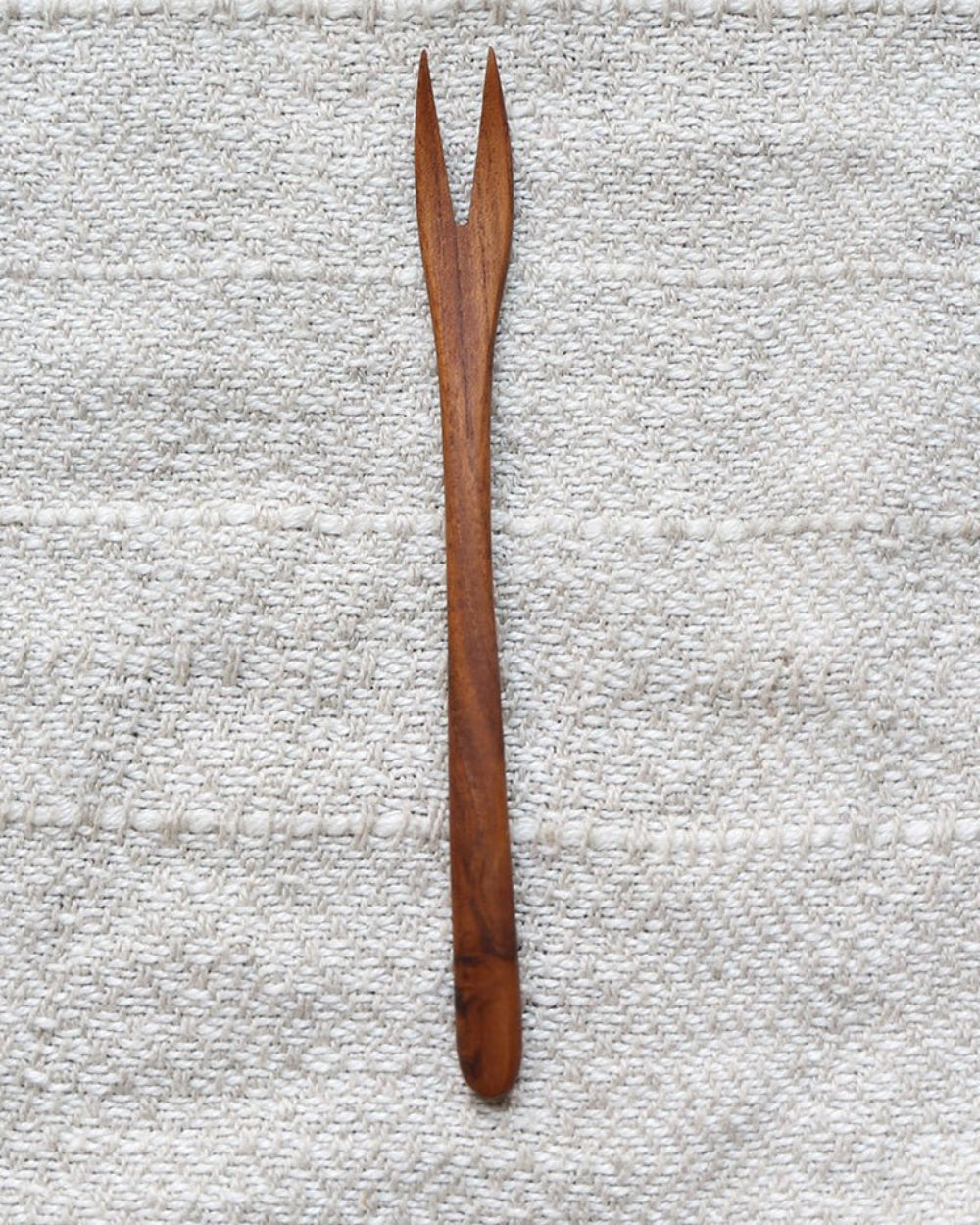 Elegant wooden fork, natural wood grain. MIN JI design, perfect for appetizers. Eco-friendly cutlery.