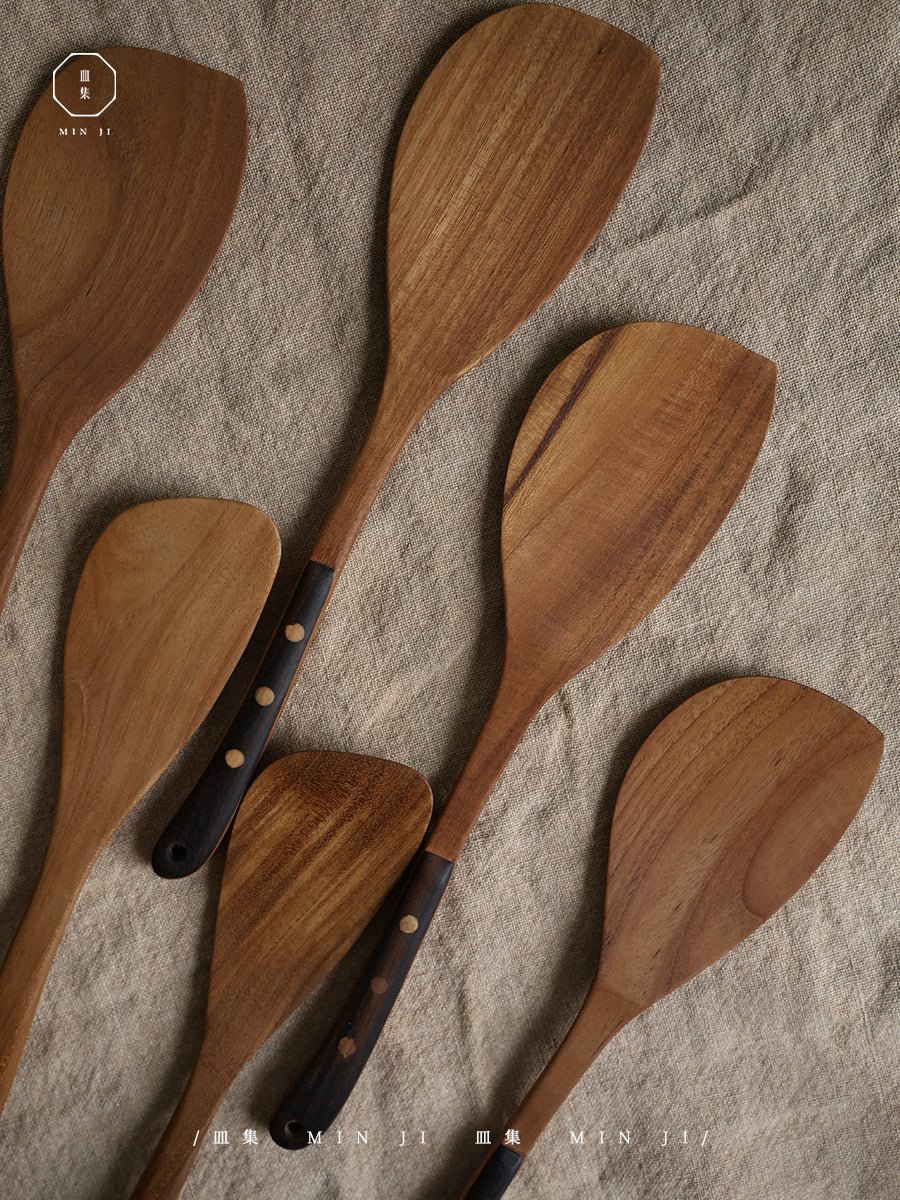 Wooden Fried Spatulas with dark handles. Product by MIN JI.