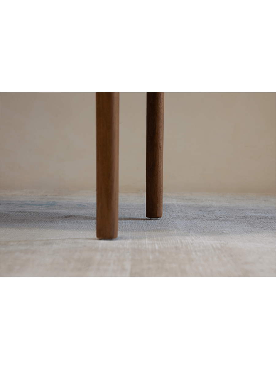 Hans Accent Table: Close-up of wooden table legs, showcasing the natural wood grain and minimalist design.