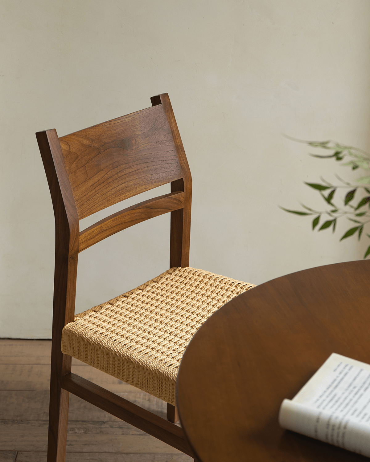 Beam Chair with teak wood frame and woven seat, perfect for small spaces and adding natural warmth to any room
