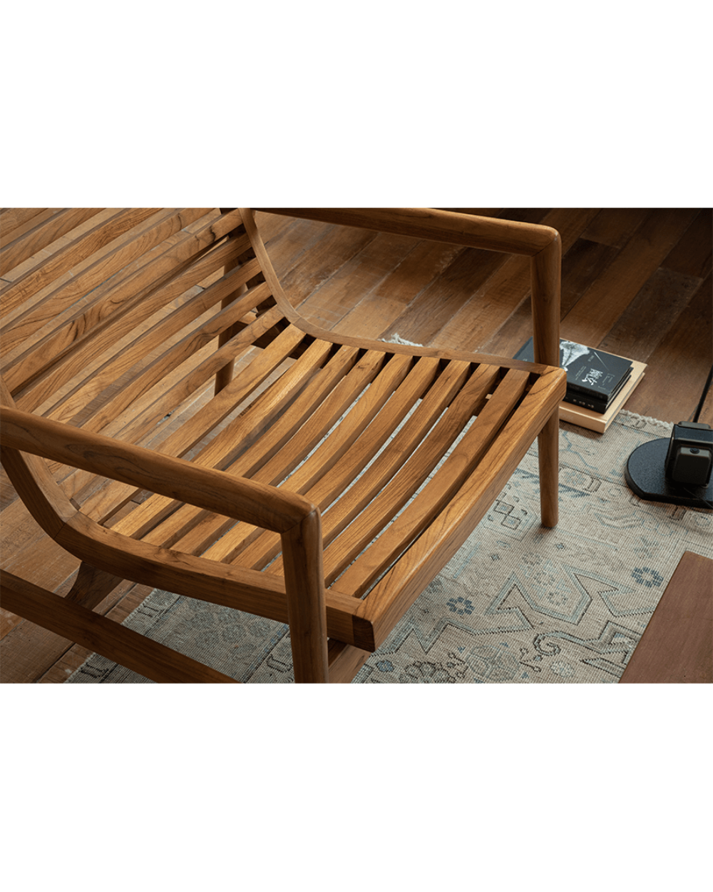 Teak wood garden lounge chair with slatted back and armrests, modern design, indoor comfort