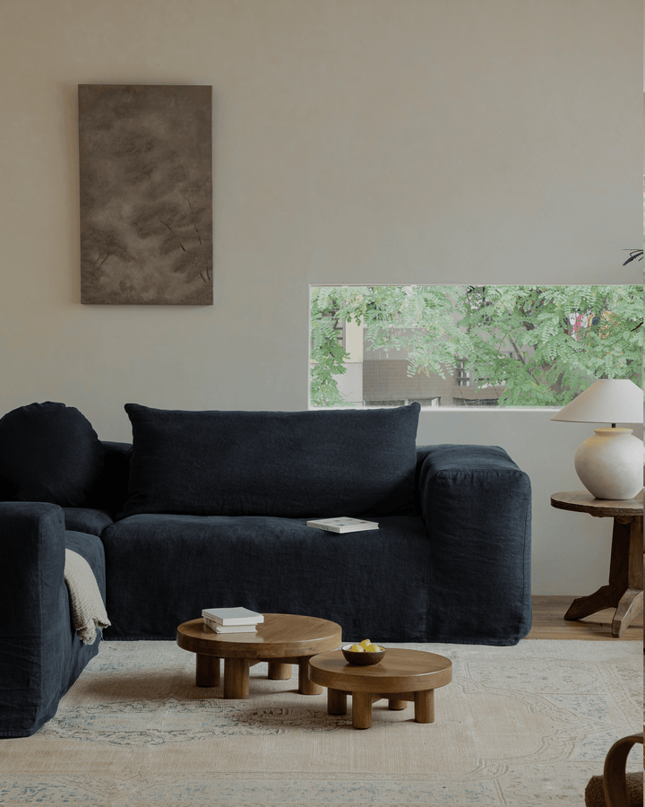 Miya Coffee Table Sets styled in a cozy living room with a dark sofa and natural light.