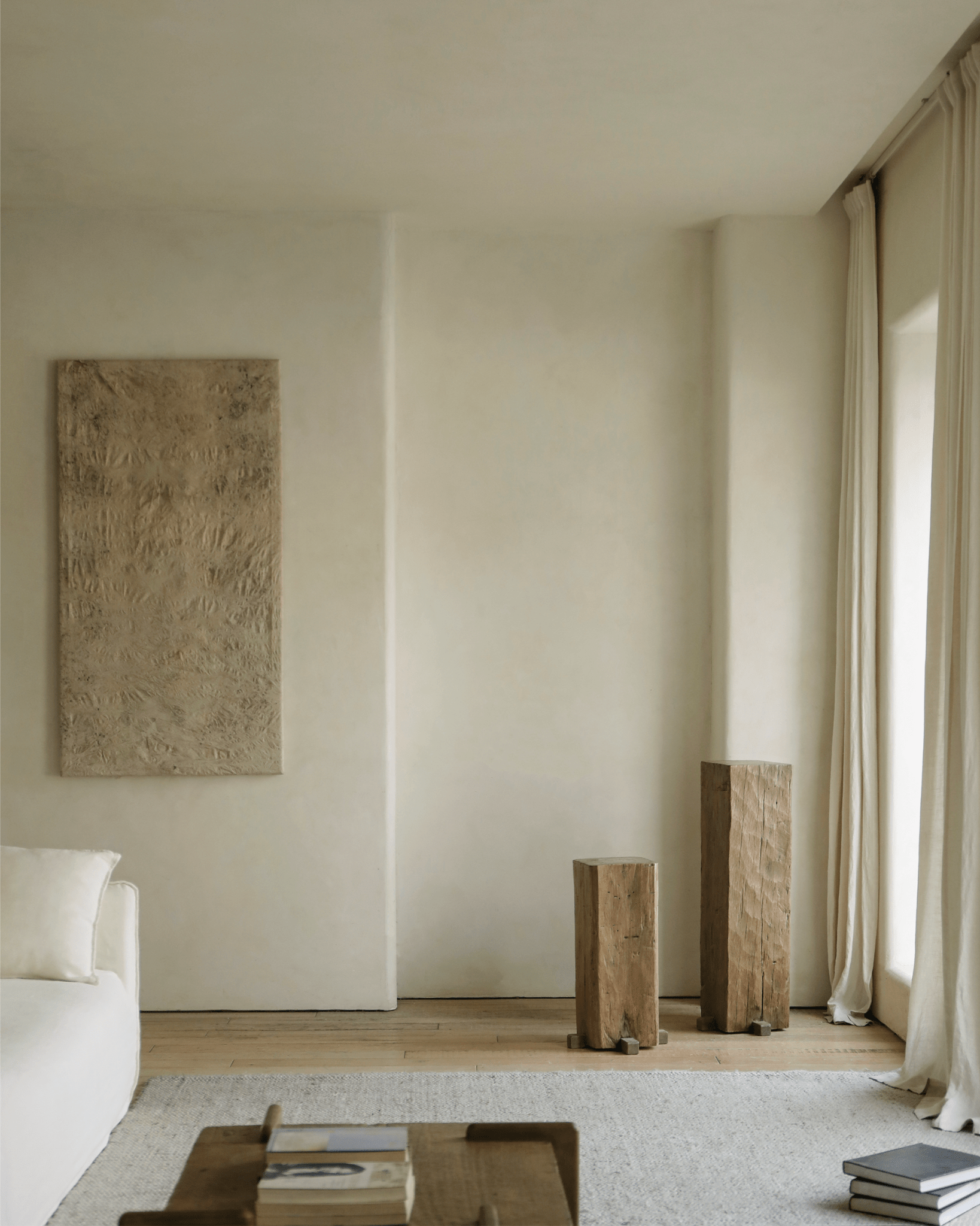Rustic wooden pedestals in organic interior, showcasing natural aging and texture, for timeless simplicity.