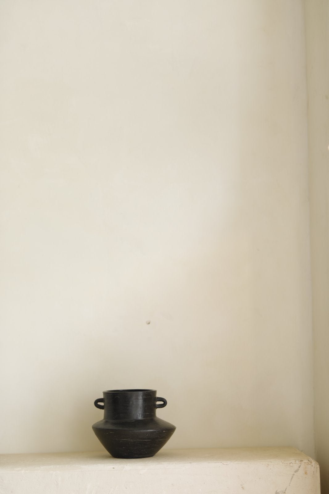 Black ceramic vase with handles, minimalist design for home decor