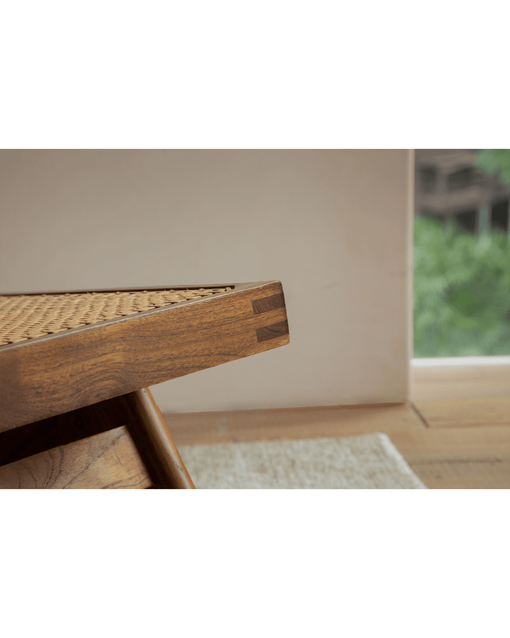 Close-up of Chandigarh Armless Easy Chair's elegant rattan detail and smooth wood finish.