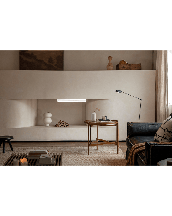 Hansen Tray Side Table in modern living room with vase, cup, and ambient lighting.