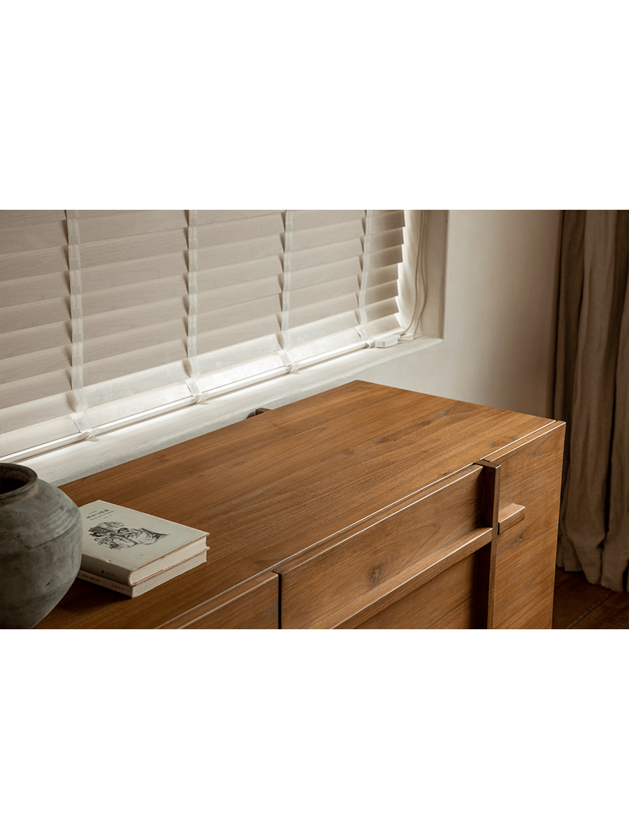 NO.42 Teak Sideboard in natural teak wood, top view, showcasing the wood grain.  With storage, book, and vase.