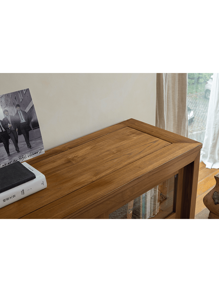 Teak wood Glass Front Bookcase close-up, highlighting wood grain and design, perfect for display.