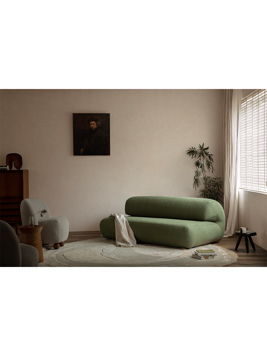 Green Wave Bouclé Sofa in stylish living room setting. Bouclé fabric and wave design.